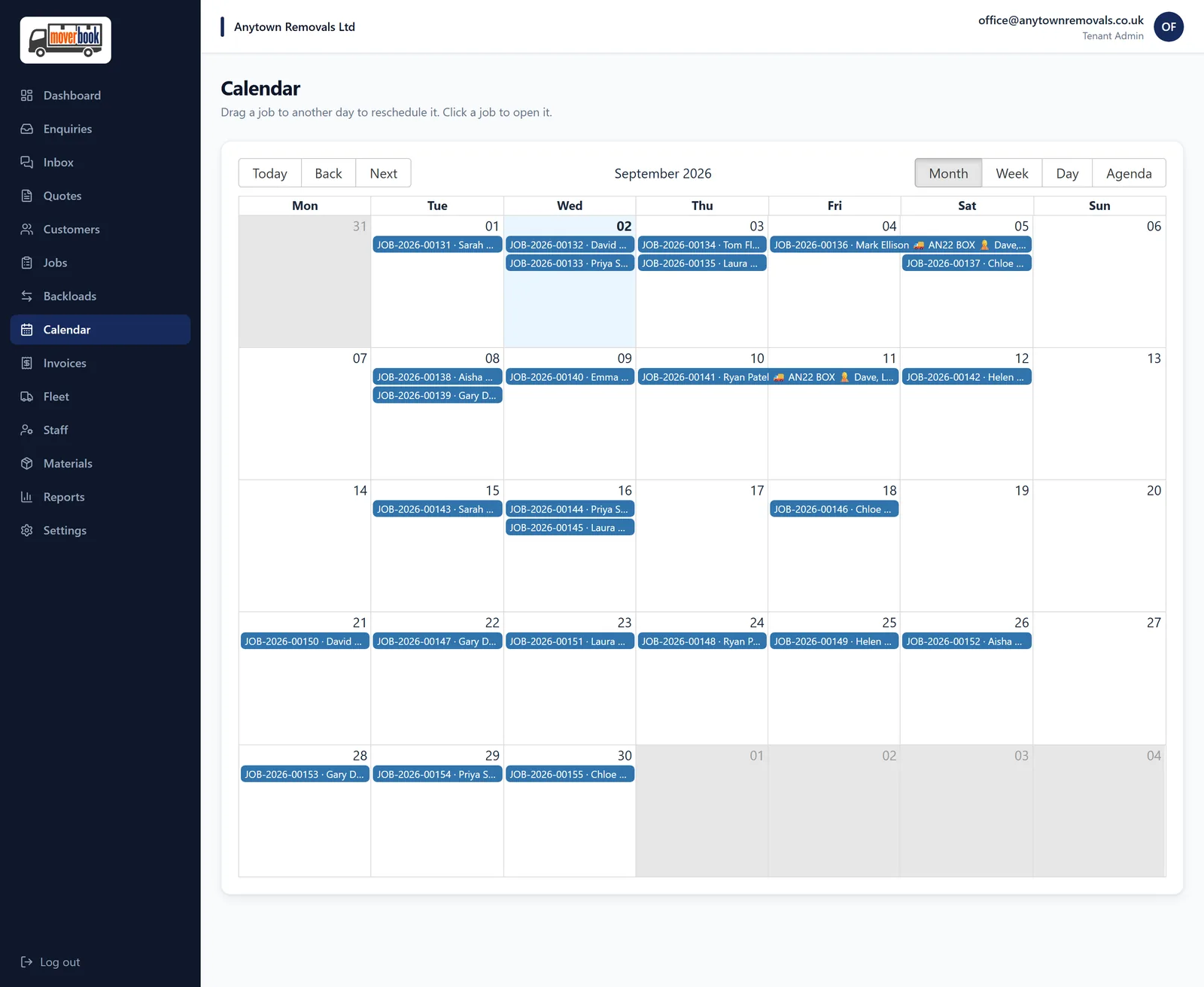 MoverBook month calendar with jobs across every week, including two multi-day moves drawn as spans